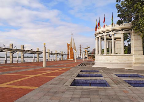 A neoclassical structure overlooking the Malecon 2000 along the Guayas riverfront in Guayaquil.