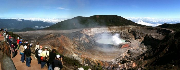 At the crater of the Poás Volcano, sulfuric furmaroles burst upwards, ruffling the calm surface of the ethereal lake. Photo by Sandra Cohen-Rose & Colin Rose/Flickr