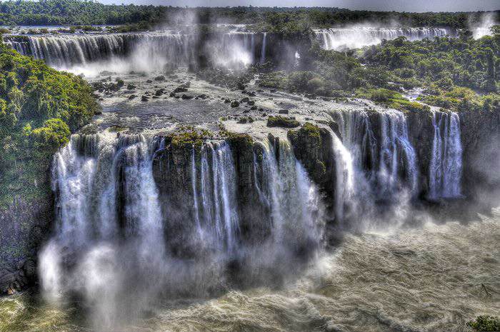 Tiers of massive waterfalls known as Iguazu Falls on the border of Argentina and Brazil.