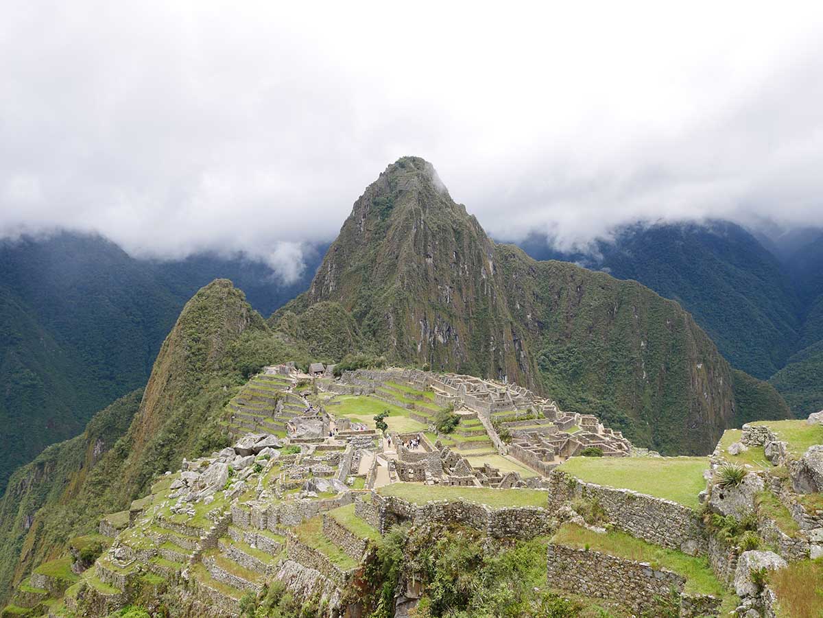 White clouds above Machu Picchu, a stone citadel in Peru.