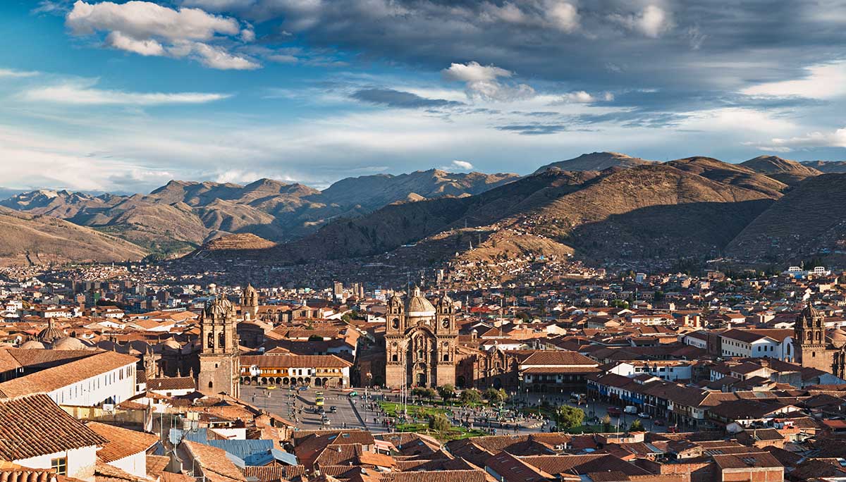 Cusco's Plaza de Armas from the air with the Andes Mountains in the distance.