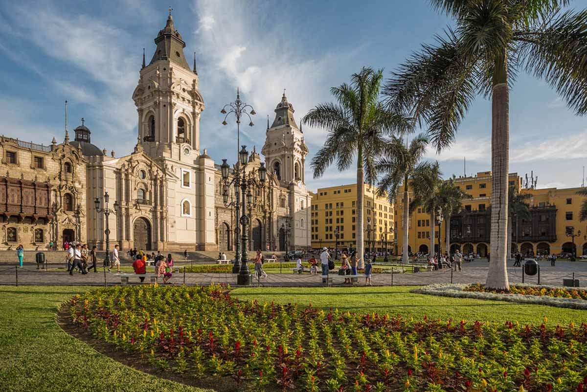 Beige and yellow buildings surround Lima's main square, the Plaza de Armas.