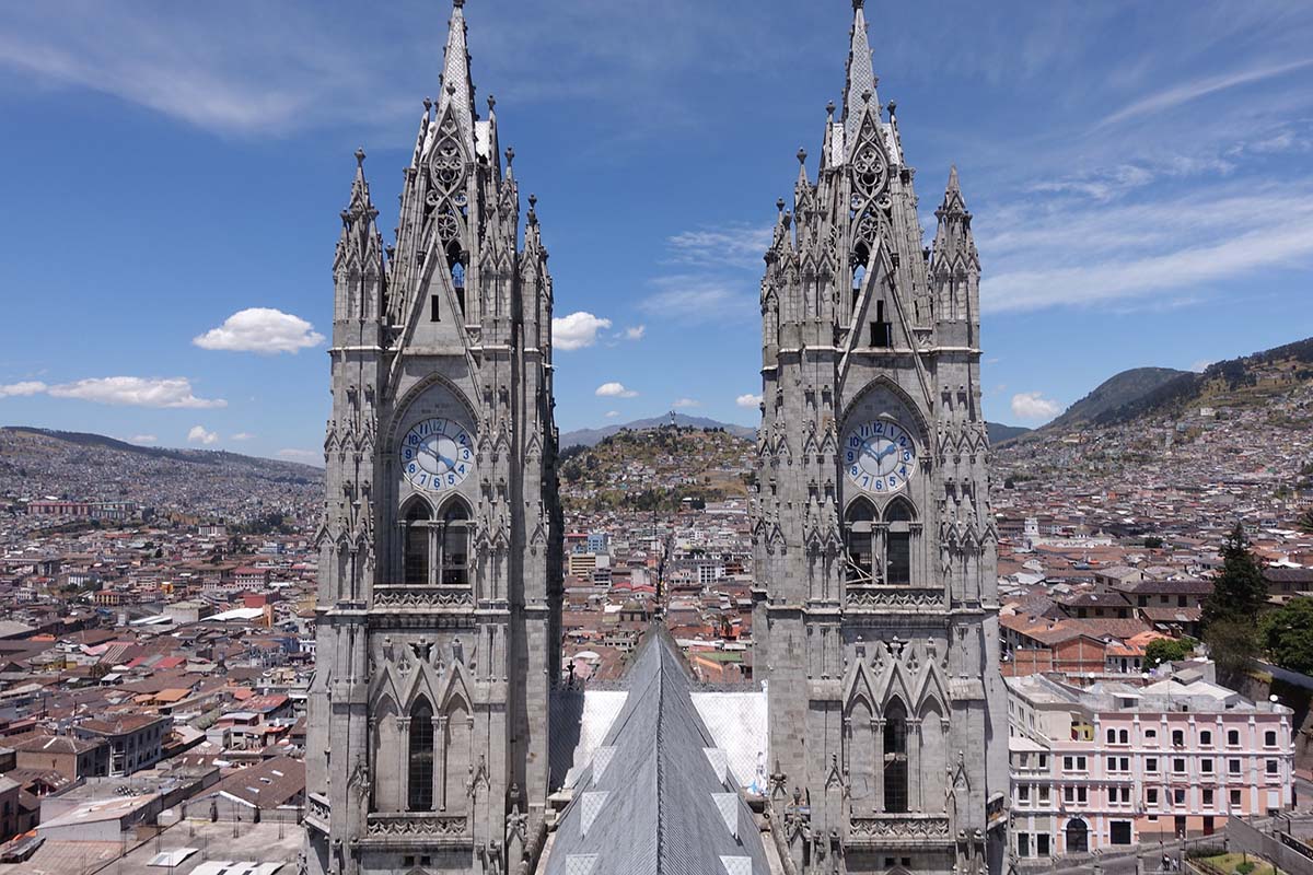 Two stone spires atop a basilica in Quito, one of the best places to visit in Ecuador.