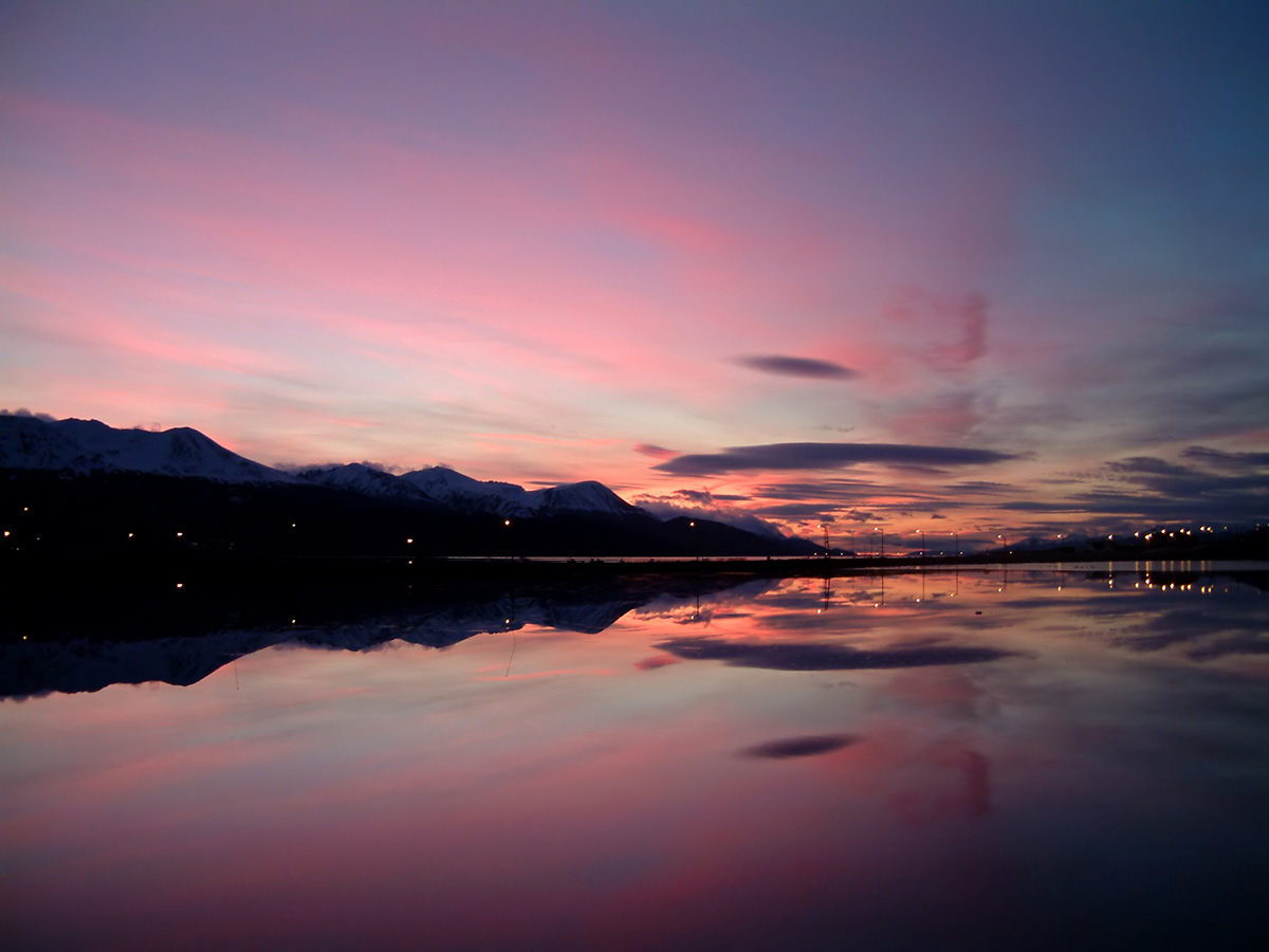 Sunset with shades of bright pink over the Beagle Channel and Ushuaia.