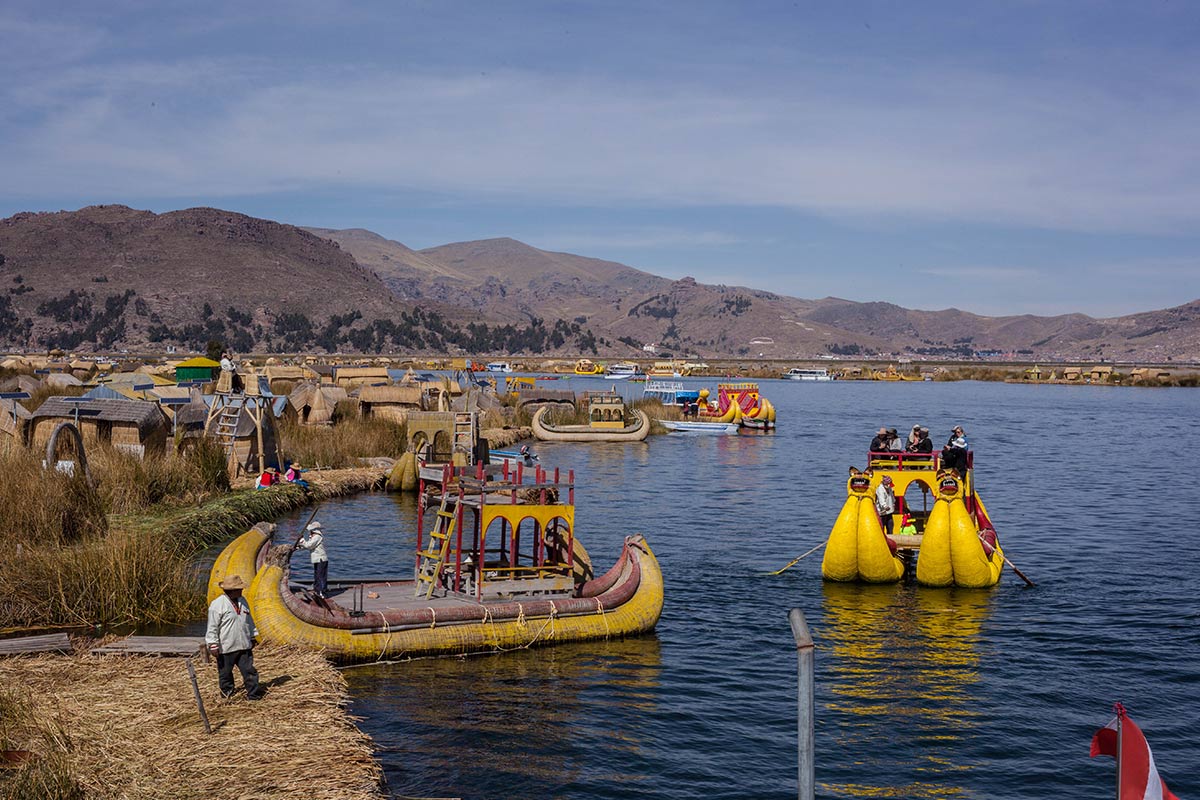 Traditional boats made of torta reeds floating in Lake Titicaca by the Floating Islands of Uros. 