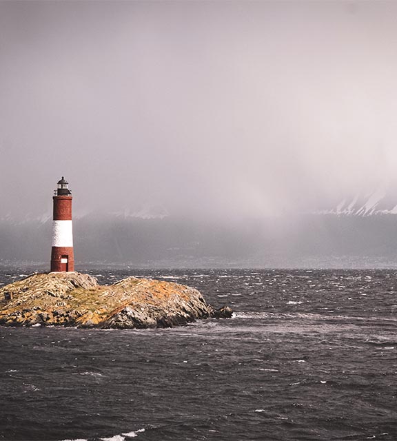 A lighthouse on a small island at Cape Horn, the meeting point of the Atlantic and Pacific Oceans.