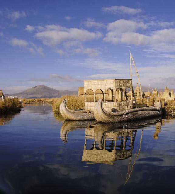 A totora reed boat docked at one of the manmade Uros Islands on Lake Titicaca in Peru.