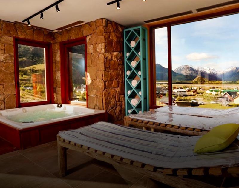 A spa area at Hotel Los Cerros in El Chalten, with a beautiful view of the surrounding landscapes.