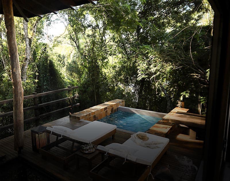 A private pool and deck at the Awasi Hotel, a luxury hotel located in Puerto Iguazu.