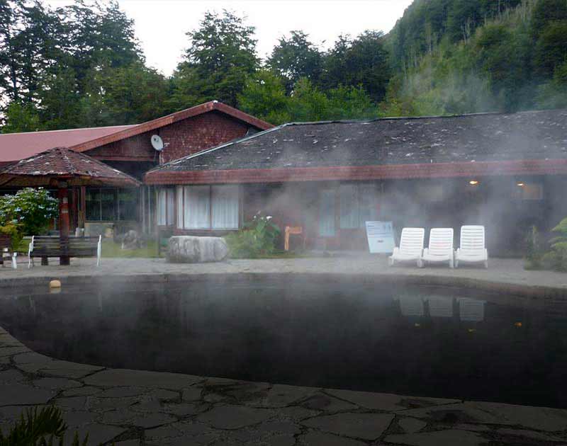 Steam rising off the surface of a thermal bath in the town of Pucón, an adventure tourism capital.