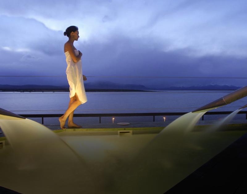 A woman with a towel wrapped around her at the Noi Indigo Patagonia Hotel in Puerto Natales.