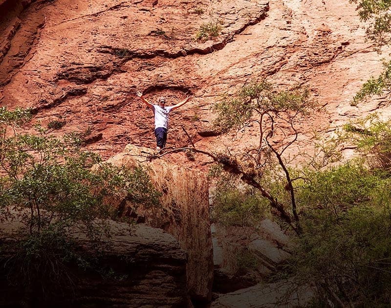 A visitor posing at the Quebrada de las Conchas, the site of a popular hiking trek in Salta.