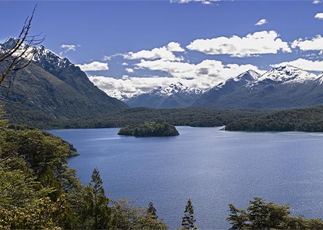 Lake Nahuel Huapi, surrounded by forests and snow-capped mountains, near the town of Bariloche.