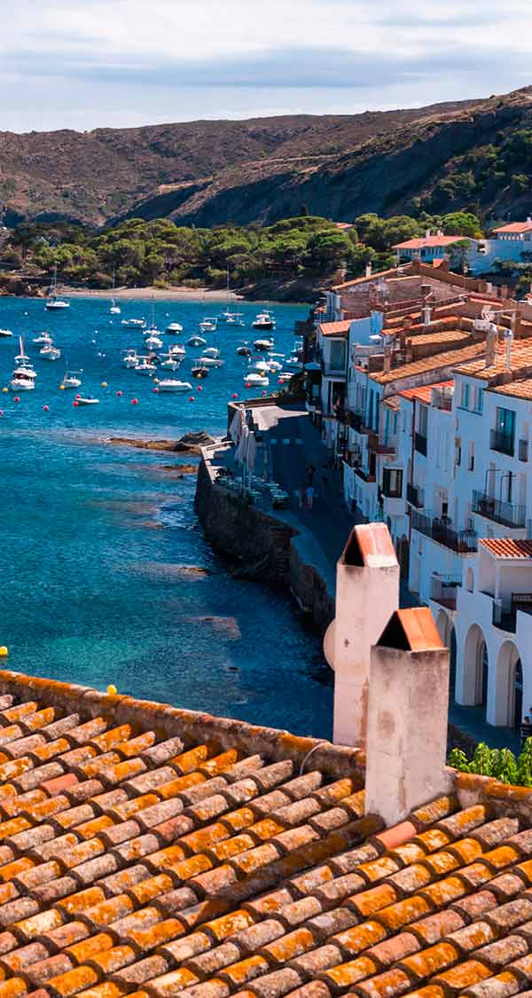 A rooftop overlooking coastal buildings and boats in the water in Salvador de Bahia.