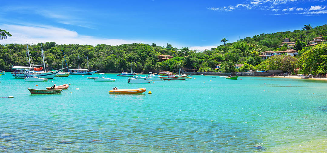 Boats in the water off the shore of Buzios, a popular beach resort town near Rio de Janeiro.