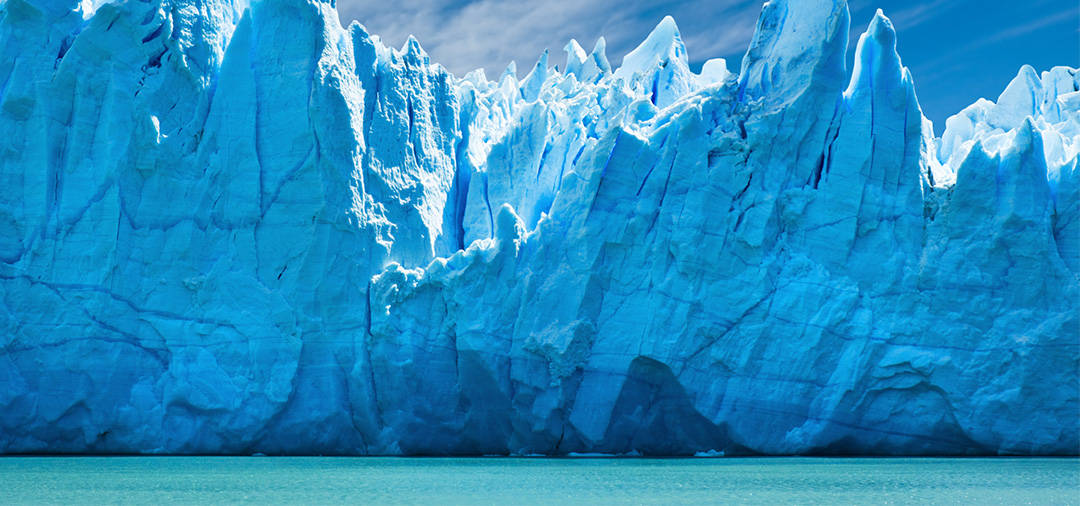 Jagged spires of a  blue-tinted glacier in Los Glaciares National Park in Argentina.