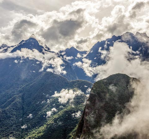 Part of the Andes Mountain range, covered in lush greenery near the ruins of Machu Picchu.