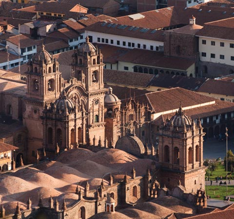An aerial view of the Plaza de Armas in Cusco, surrounded by historic colonial buildings.