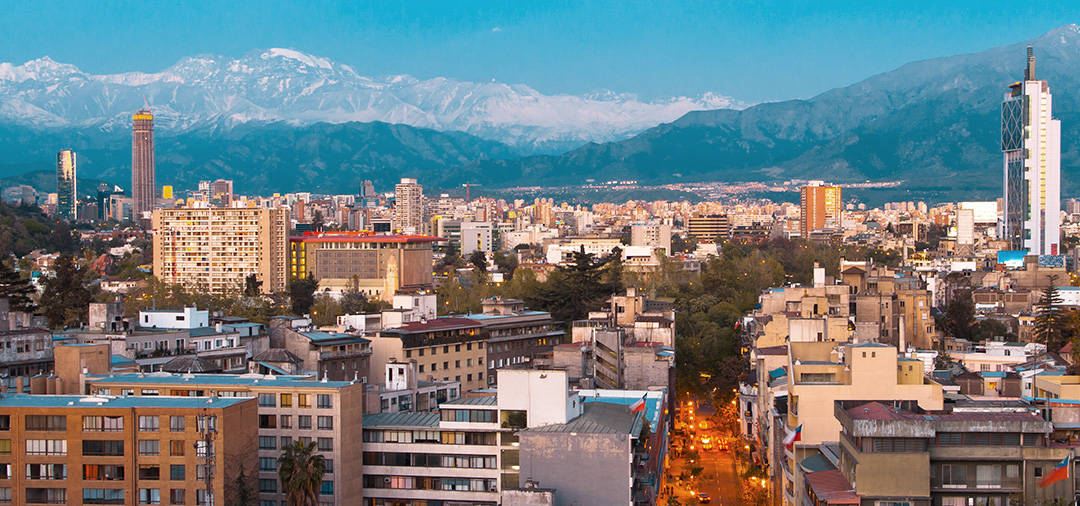 View of the city of Santiago, with the snow-capped Andes Mountains towering overhead.