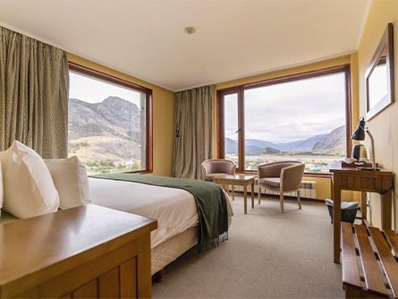 A modern room at Hotel Los Cerros, facing out at the Patagonian landscapes of El Chalten.