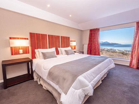 A beautifully-decorated room with a view of the Beagle Channel at Los Acebos Hotel in Ushuaia.