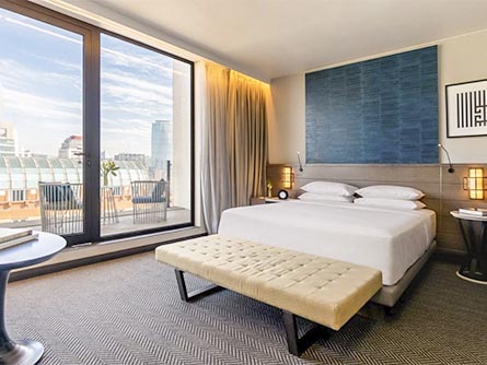 A modern and tastefully decorated room with a balcony at the Mandarin Oriental Hotel in Santiago.