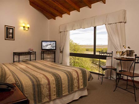 A cozy room facing out towards the Patagonian landscape at the Sierra Nevada hotel in El Calafate.