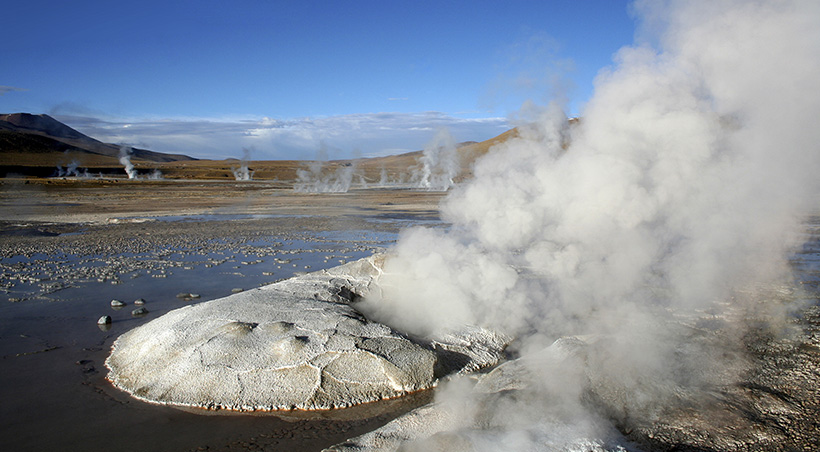 Multiple geysers emitting steam in the Tatio Geyser field of the Atacama Desert.