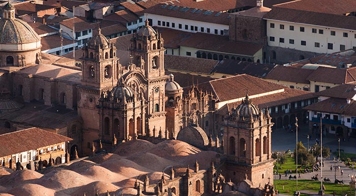 An aerial view of the Plaza de Armas in Cusco, surrounded by historic colonial buildings.