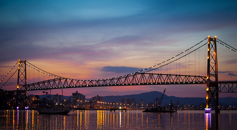 Sunset over Hercílio Luz bridge, linking Santa Catarina Island to the Brazilian mainland.