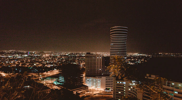 The sprawling city of Guayaquil, the largest city in Ecuador, illuminated at nighttime.