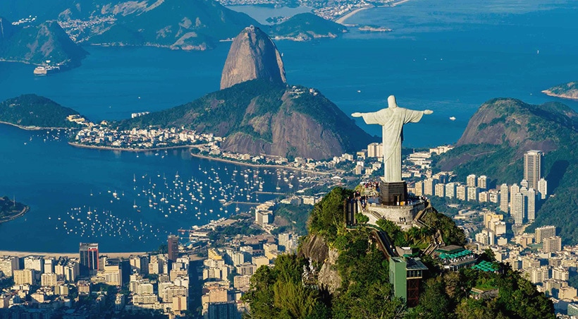 The Christ the Redeemer statue overlooking Sugarloaf Mountain and the city of Rio de Janeiro.