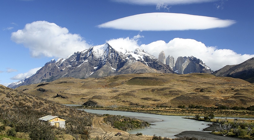 A rustic scene at Torres del Paine National Park with two of the distinctive peaks visible.
