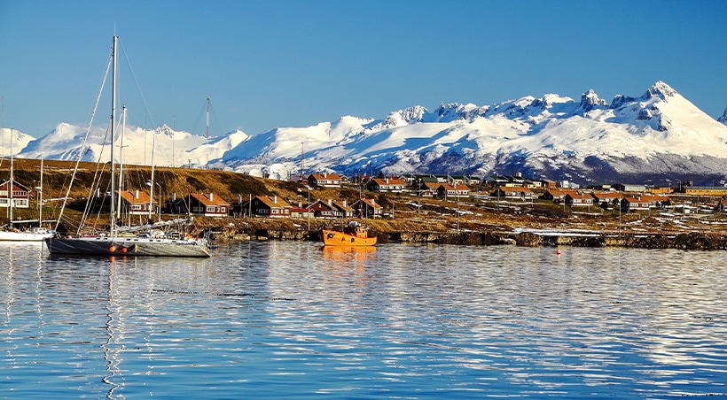 Snow-covered mountains overlooking the port of Ushuaia, the southernmost city in the world.