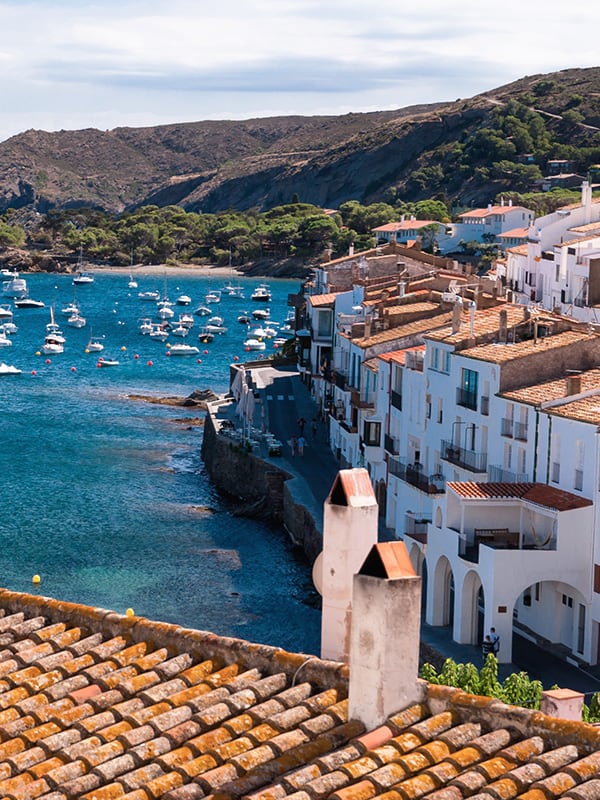 A rooftop overlooking coastal buildings and boats in the water in Salvador de Bahia.