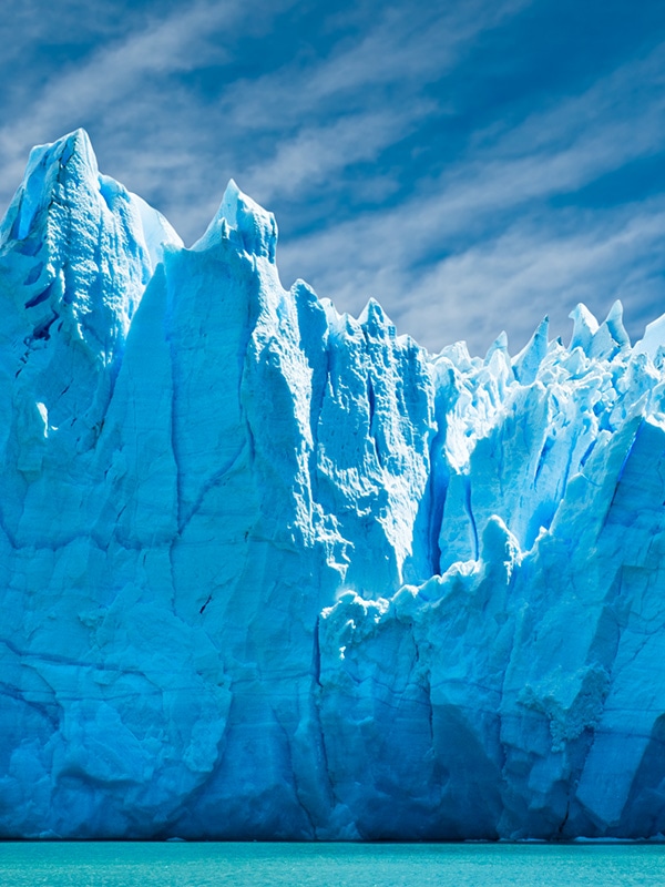 Jagged spires of a  blue-tinted glacier in Los Glaciares National Park in Argentina.