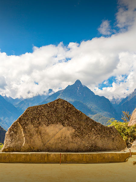 The Sacred Rock at Machu Picchu, whose shape mimics that of the mountains behind it.