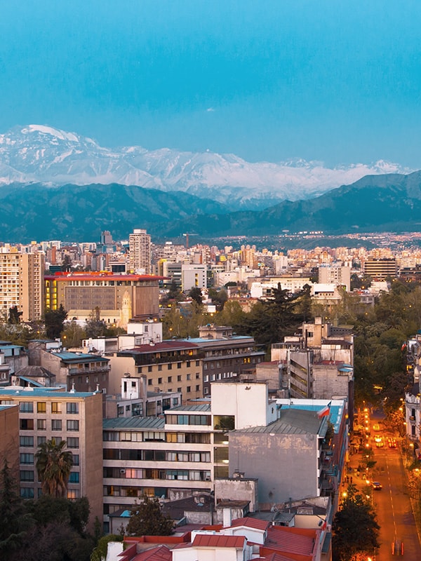 View of the city of Santiago, with the snow-capped Andes Mountains towering overhead.