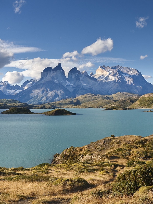 A couple of hikers stopping for a photo on the trek to Torres del Paine in Chilean Patagonia.