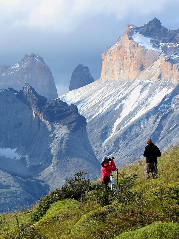A couple of hikers stopping for a photo on the trek to Torres del Paine in Chilean Patagonia.