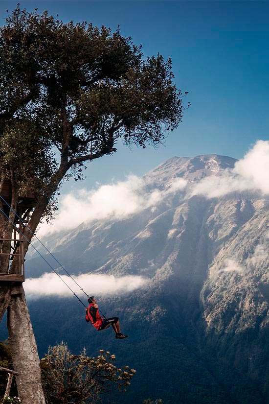 A visitor swinging on the ‘Swing at the End of the World,’ a popular attraction in Baños.