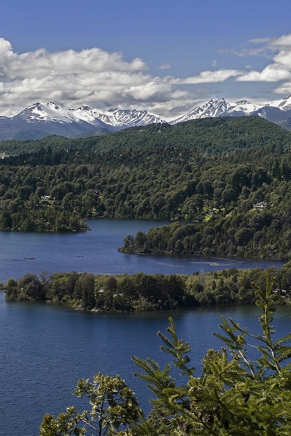 The gorgeous Lake Nahuel Huapi, surrounded by snow-capped mountains and alpine forest.