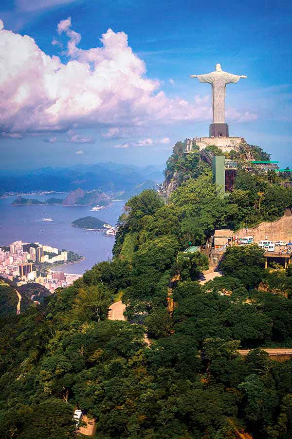 Christ the Redeemer overlooking Rio de Janeiro and the iconic Sugarloaf Mountain.