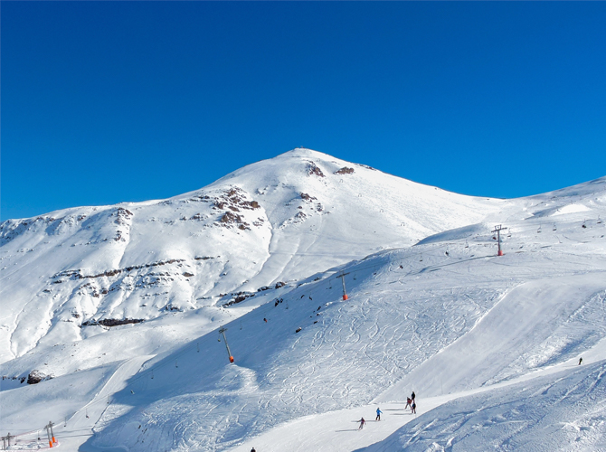 Snowy mountain landscape at the Cerro Catedral with blue skies