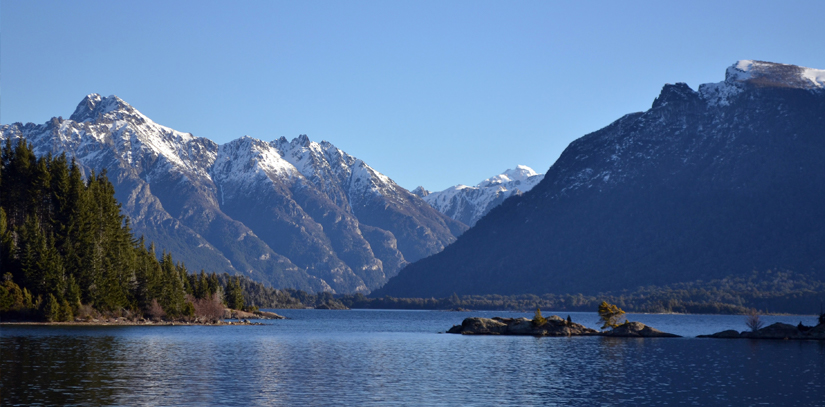 Scenic lake surrounded by the forests and mountains in the countryside near the town of Bariloche
