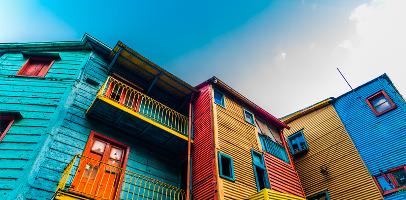 A row of colorfully painted houses in the La Boca neighbourhood of Buenos Aires