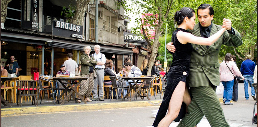 A pair of dances performing tango, an iconic dance and cultural symbol of Buenos Aires