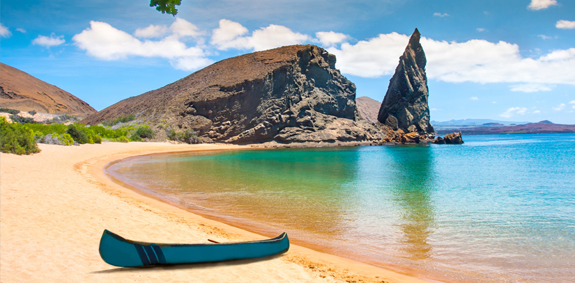 A long sandy beach and crystal clear blue water, a boat sits on the sand