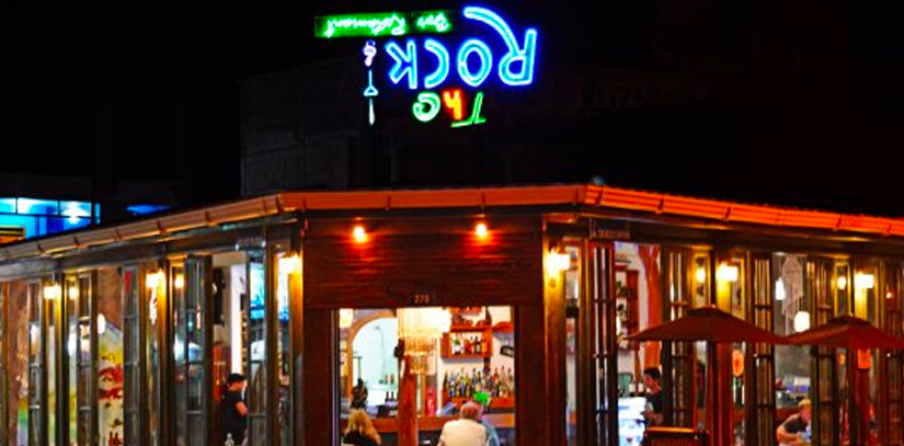 The Rock, a popular bar in the Galapagos, illuminated by lights