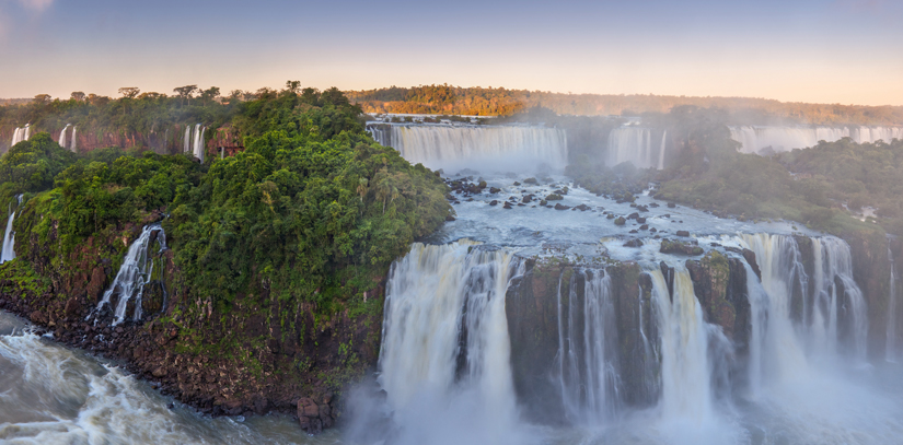 The impressive Igazu Waterfall surrounded by a green forest area